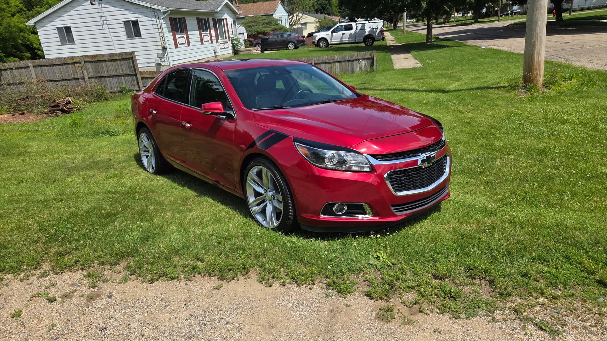 Red Chevrolet Malibu with corrected, high-gloss paint